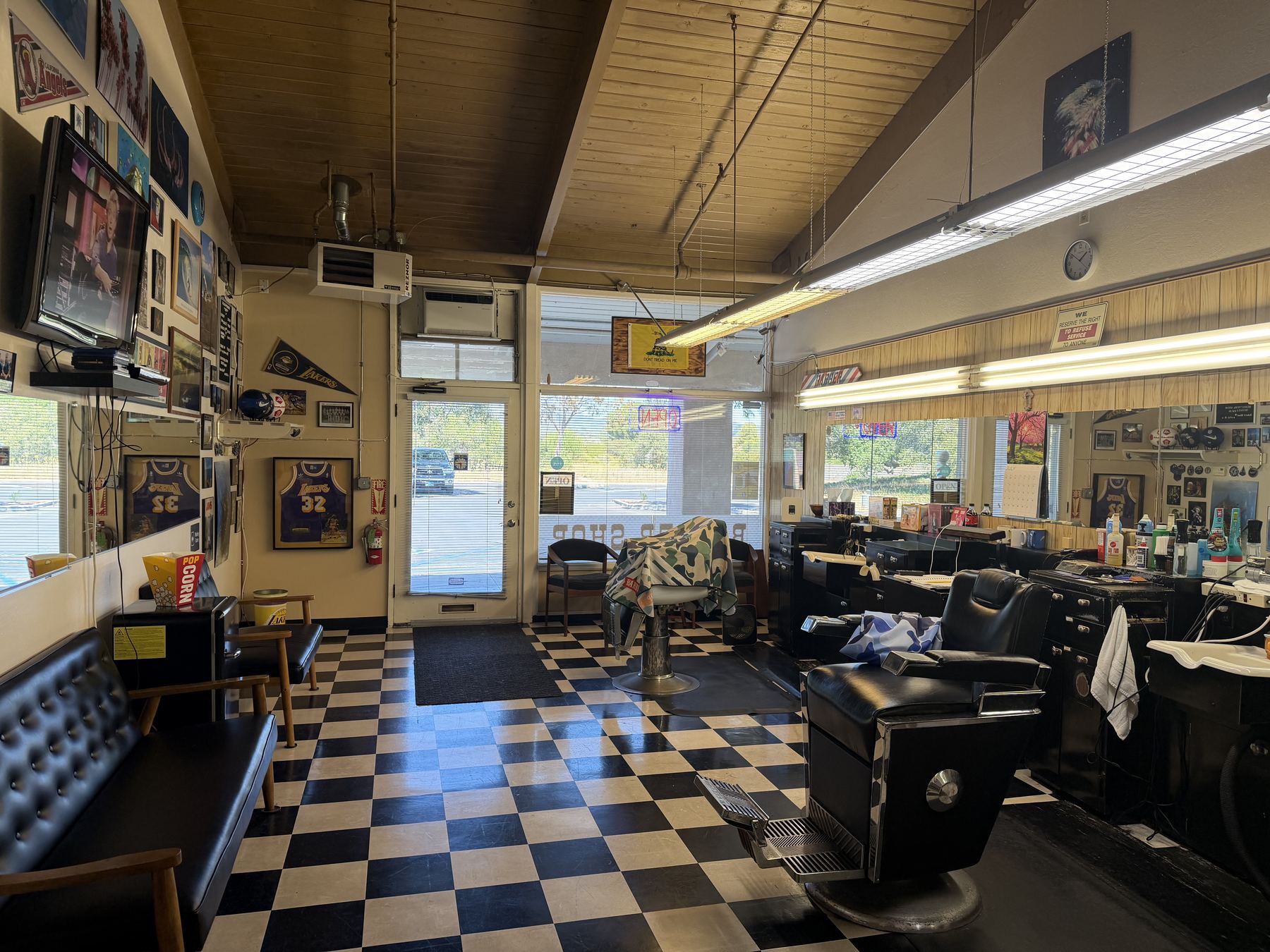 Front waiting room and checkerboard floor at Village Barber Shop